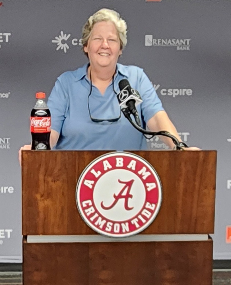 Charlene Scott behind the media room podium